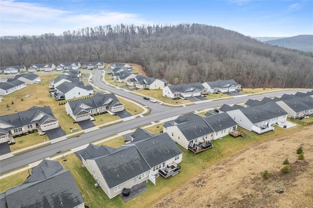 bird's eye view featuring a residential view and a view of trees