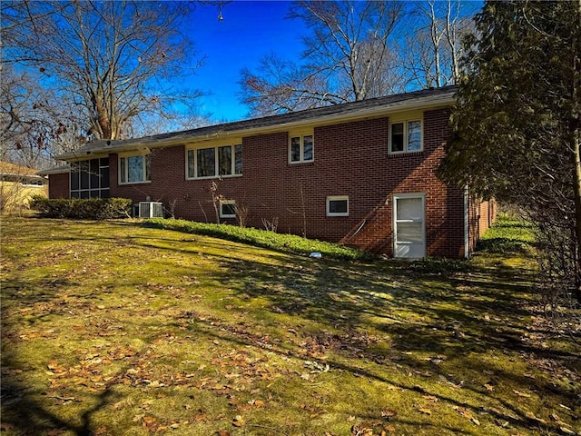 720 Dogwood Ln, Hermitage, PA 16148 - rear view of property with a yard, central AC, and brick siding
