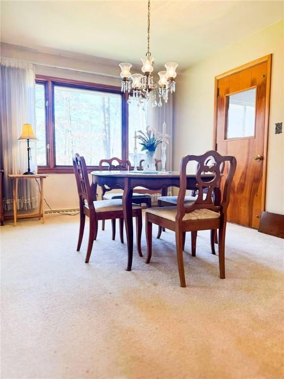 720 Dogwood Ln, Hermitage, PA 16148 - carpeted dining space featuring an inviting chandelier