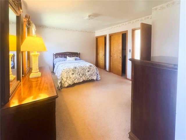 720 Dogwood Ln, Hermitage, PA 16148 - bedroom with carpet floors and multiple closets