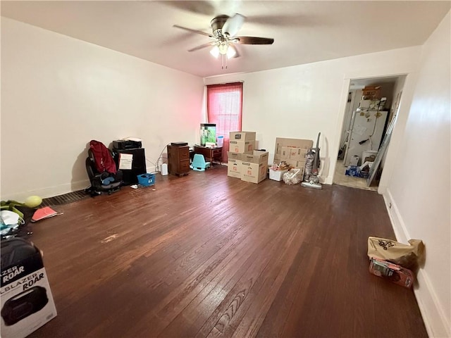 misc room featuring ceiling fan, wood finished floors, and baseboards