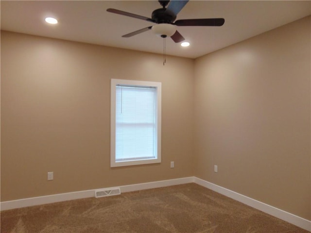 carpeted spare room with ceiling fan, recessed lighting, visible vents, and baseboards