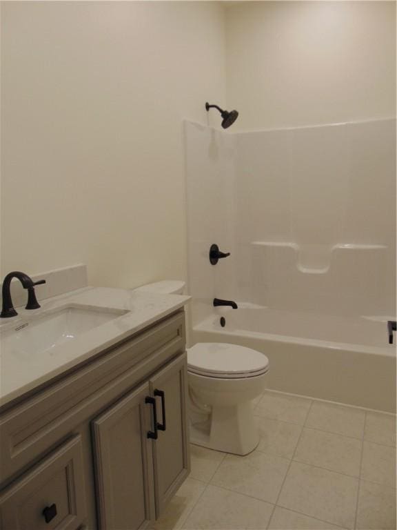 bathroom featuring toilet, tile patterned flooring, shower / tub combination, and vanity