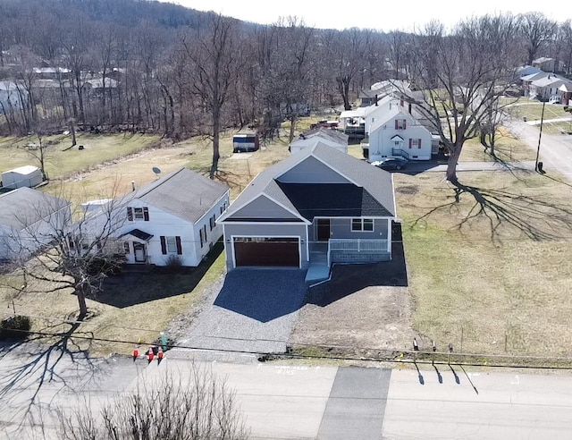 drone / aerial view with a wooded view