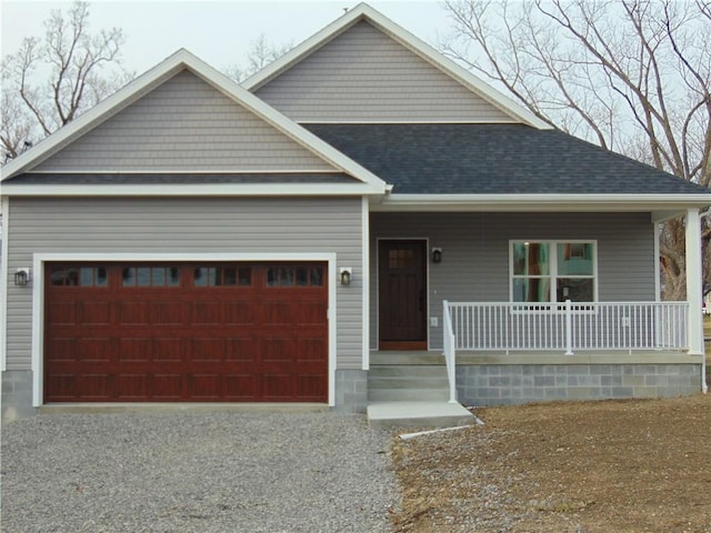 view of front of property featuring an attached garage, a shingled roof, a porch, and gravel driveway