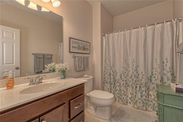 full bath featuring a shower with curtain, vanity, toilet, and tile patterned floors