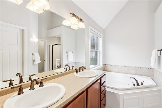 full bathroom with lofted ceiling, a sink, a jetted tub, and a shower stall