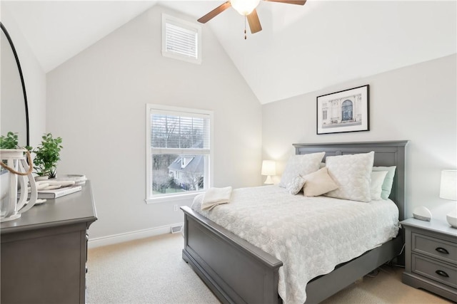 bedroom featuring lofted ceiling, light carpet, ceiling fan, and baseboards