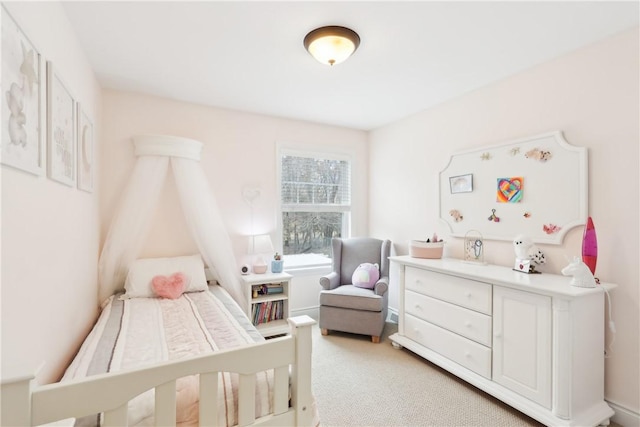 bedroom featuring light colored carpet