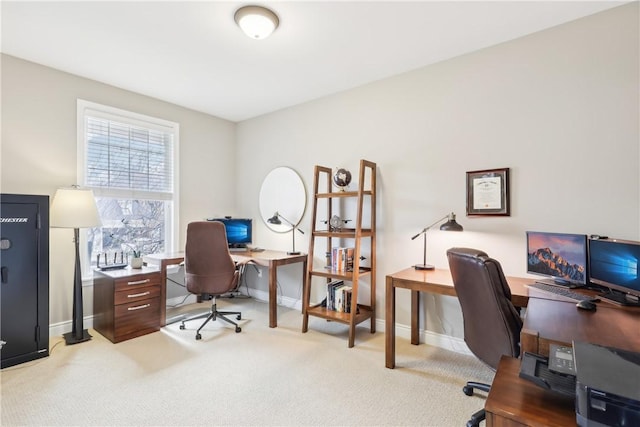 home office featuring light colored carpet and baseboards