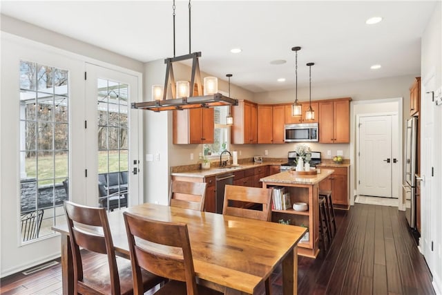 dining space with recessed lighting, dark wood-style flooring, and visible vents