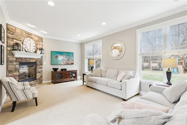 living room with light carpet, ornamental molding, a fireplace, and a wealth of natural light