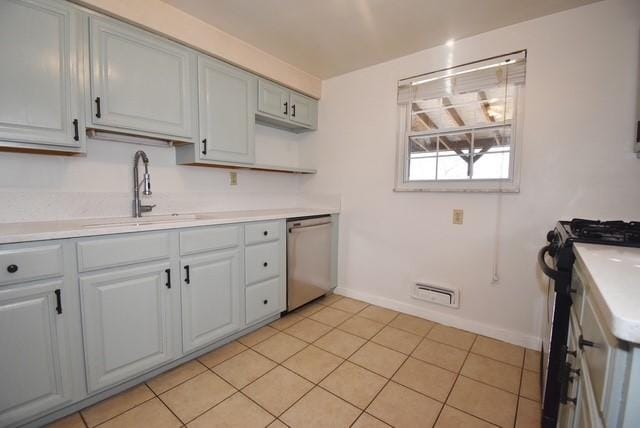 kitchen with black range with gas cooktop, visible vents, dishwasher, light countertops, and a sink