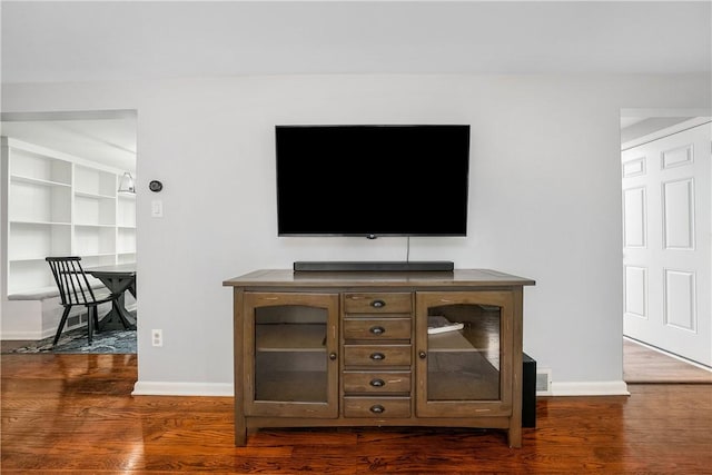 details with baseboards and wood finished floors