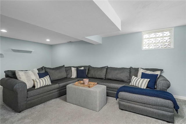 carpeted living room featuring baseboards and recessed lighting