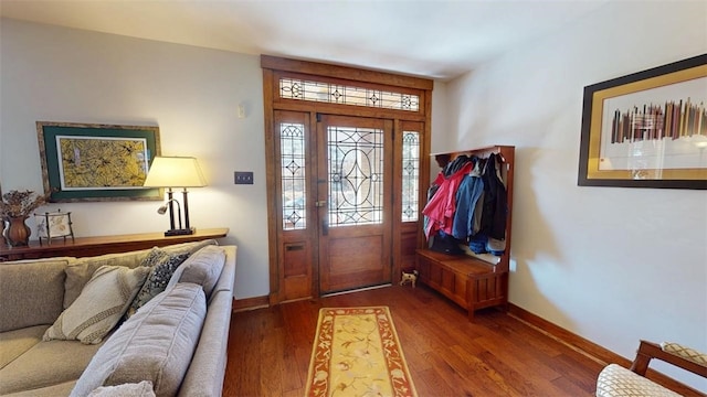 entryway featuring baseboards and dark wood-type flooring