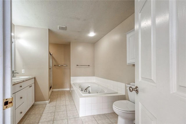 bathroom featuring a stall shower, visible vents, a garden tub, tile patterned flooring, and vanity