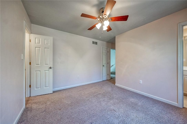 interior space with carpet floors, visible vents, and baseboards