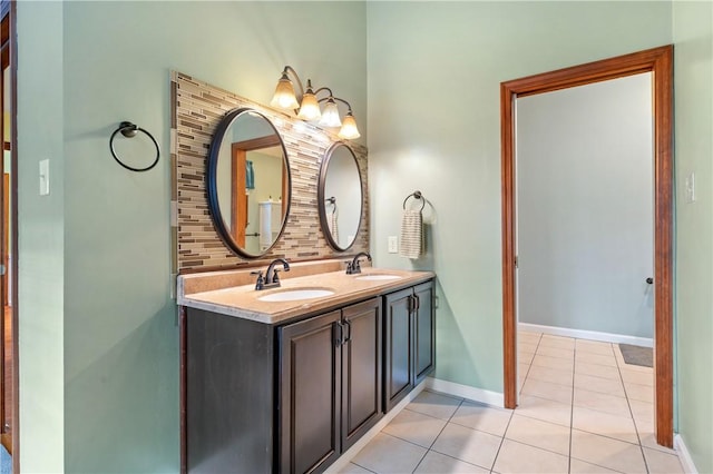 full bathroom featuring a sink, backsplash, baseboards, and tile patterned floors