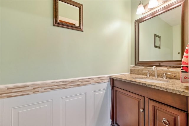 bathroom featuring wainscoting and vanity