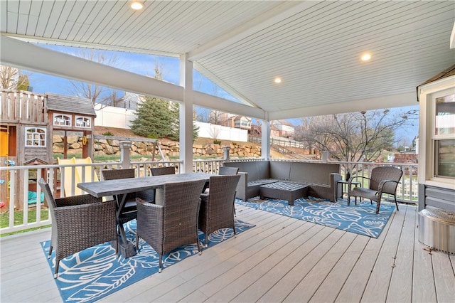 deck featuring outdoor dining area