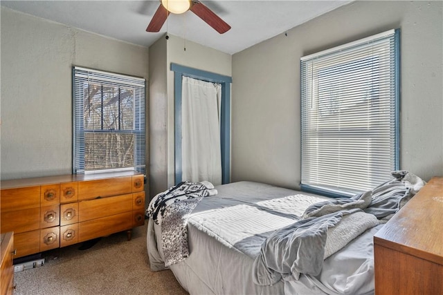 carpeted bedroom featuring a ceiling fan