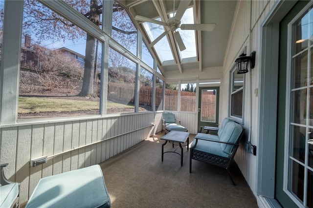 sunroom / solarium featuring a ceiling fan and lofted ceiling