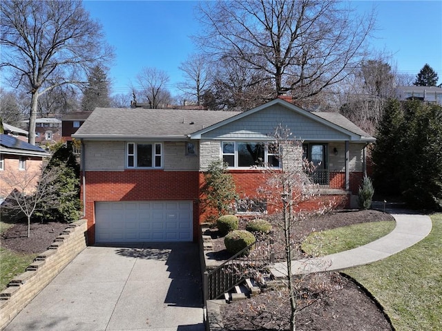 ranch-style home featuring brick siding, driveway, and an attached garage