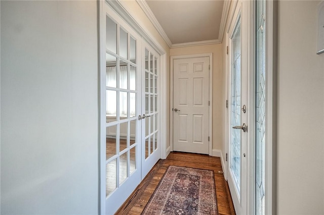 doorway to outside featuring baseboards, dark wood finished floors, crown molding, and french doors