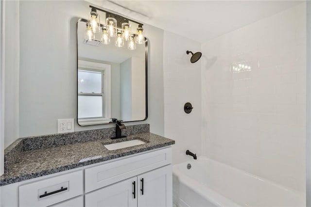 full bathroom featuring washtub / shower combination and vanity