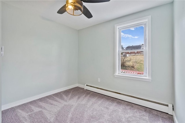 carpeted spare room featuring a ceiling fan, baseboards, and baseboard heating