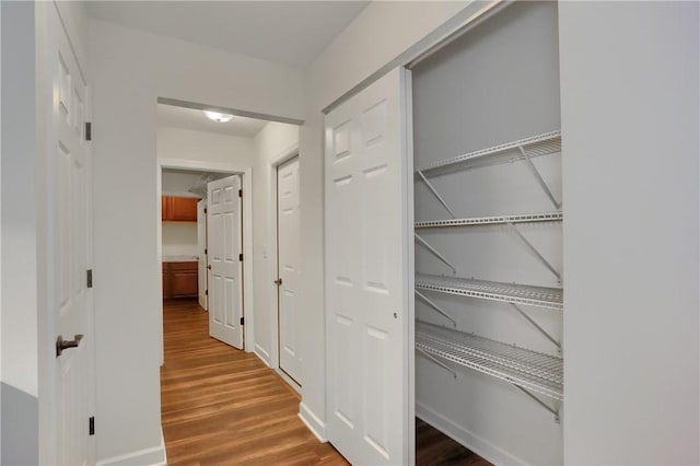 hallway with wood finished floors