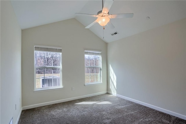 empty room featuring visible vents, lofted ceiling, carpet, baseboards, and ceiling fan