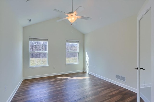 unfurnished room featuring visible vents, baseboards, and dark wood-style floors