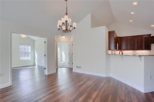 unfurnished dining area featuring visible vents, baseboards, lofted ceiling, and dark wood-style flooring