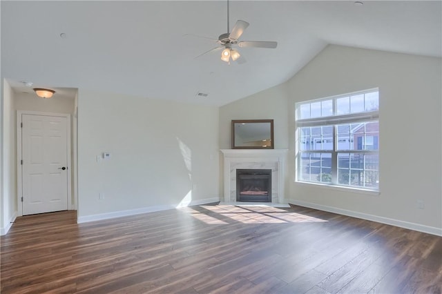 unfurnished living room featuring visible vents, baseboards, wood finished floors, and a high end fireplace