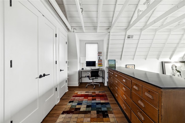 home office featuring dark wood-style flooring, beamed ceiling, and visible vents