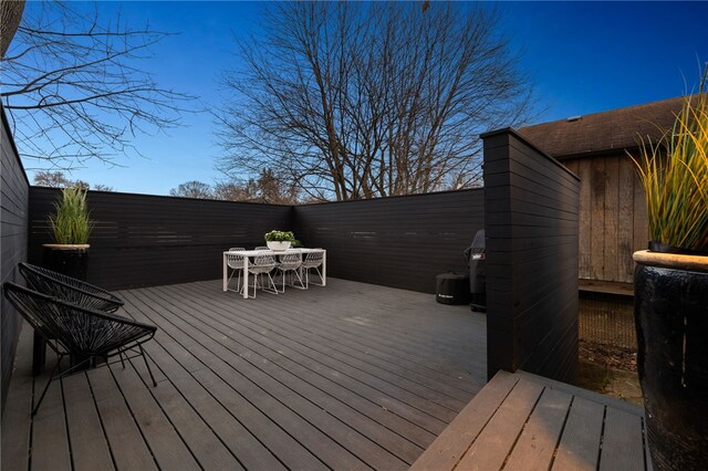 deck with outdoor dining area