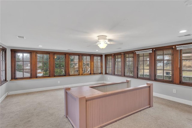 unfurnished office with baseboards, recessed lighting, visible vents, and light colored carpet