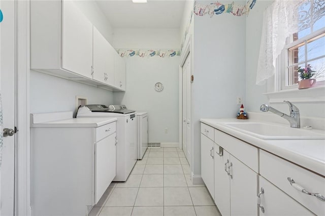 1012 Country Club Dr, Penn Twp Wml, PA 15644 - clothes washing area with cabinet space, light tile patterned floors, baseboards, independent washer and dryer, and a sink