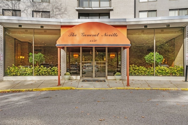 property entrance with brick siding