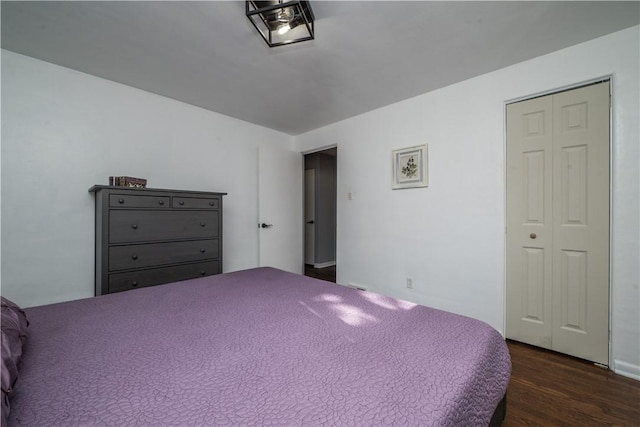 bedroom with a closet and wood finished floors