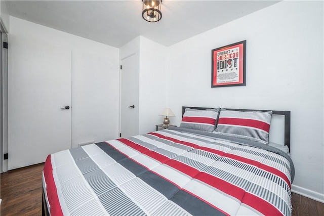 bedroom with wood finished floors