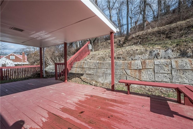 deck featuring visible vents, fence, and stairs