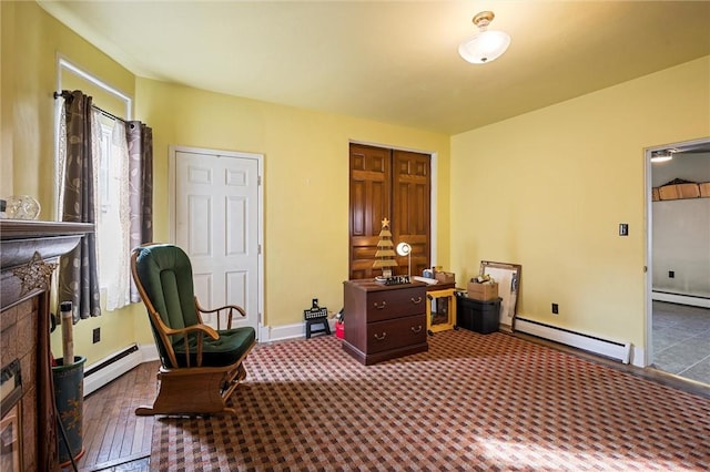 interior space featuring a wealth of natural light, a baseboard radiator, baseboards, and baseboard heating