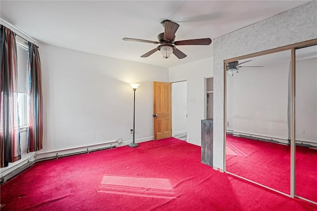 unfurnished bedroom with a ceiling fan, a baseboard radiator, carpet flooring, a baseboard heating unit, and a closet