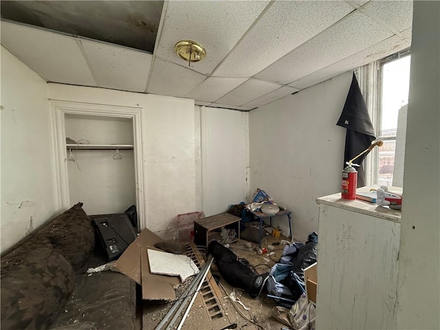 bedroom featuring a closet and a drop ceiling