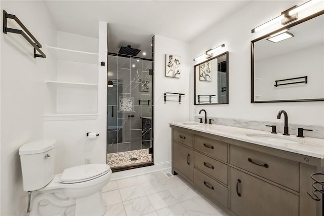 bathroom featuring marble finish floor, a stall shower, a sink, and toilet