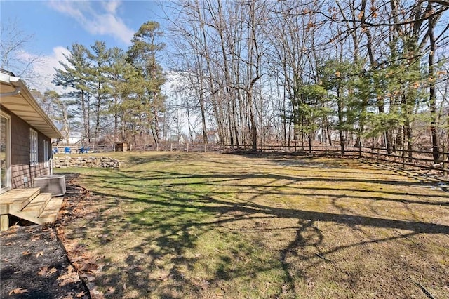 view of yard with cooling unit and fence