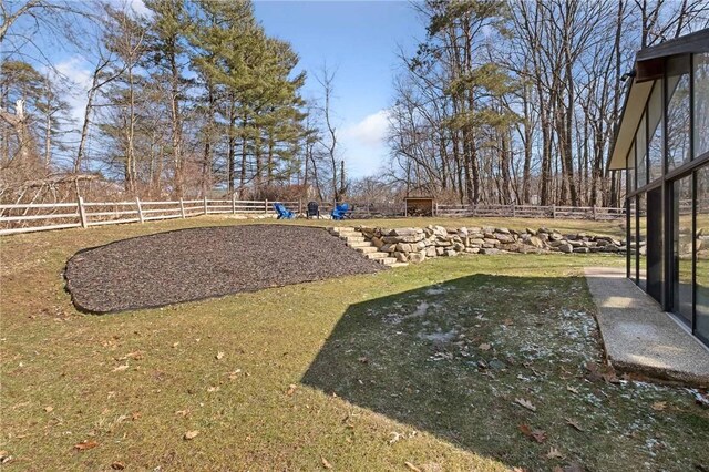 view of yard with fence and a playground